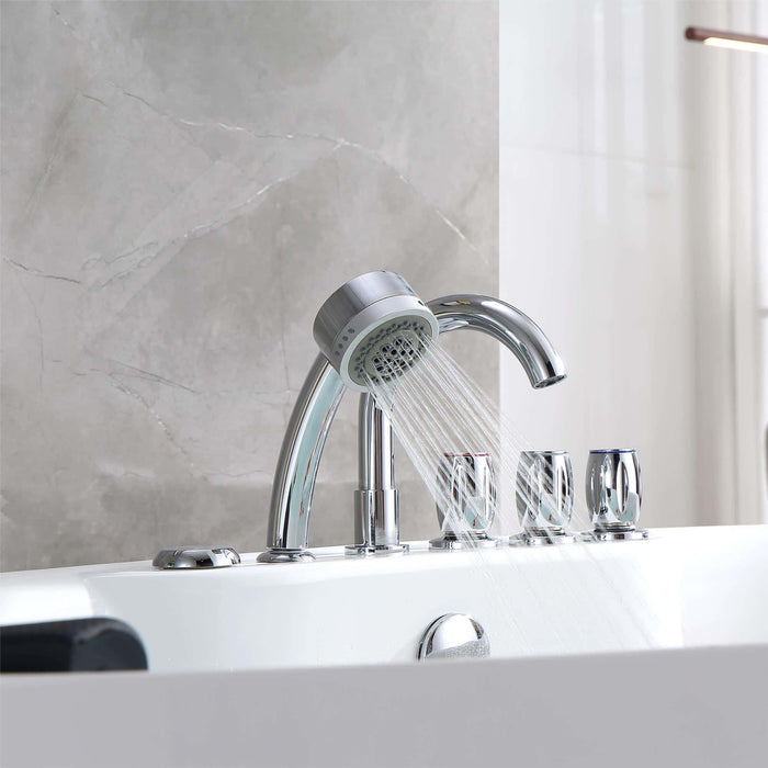 Modern chrome bath faucet with multiple controls and a running showerhead against a marble-like gray wall.