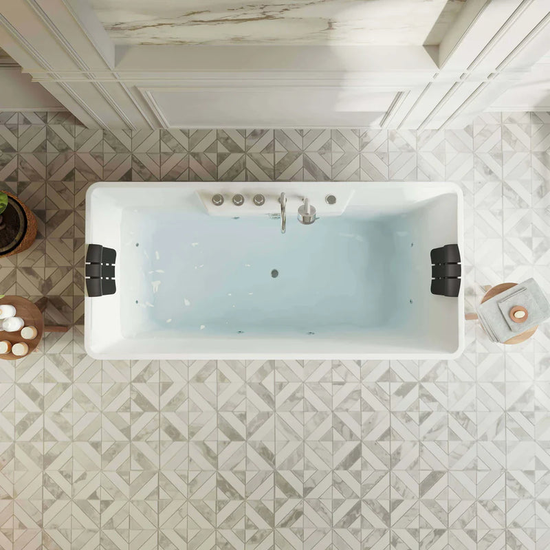 Overhead view of a white rectangular bathtub with geometric patterned tile floor, featuring spa accessories and neutral decor.
