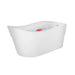 Modern white freestanding bathtub with blue water and small red rose petals floating on the surface.