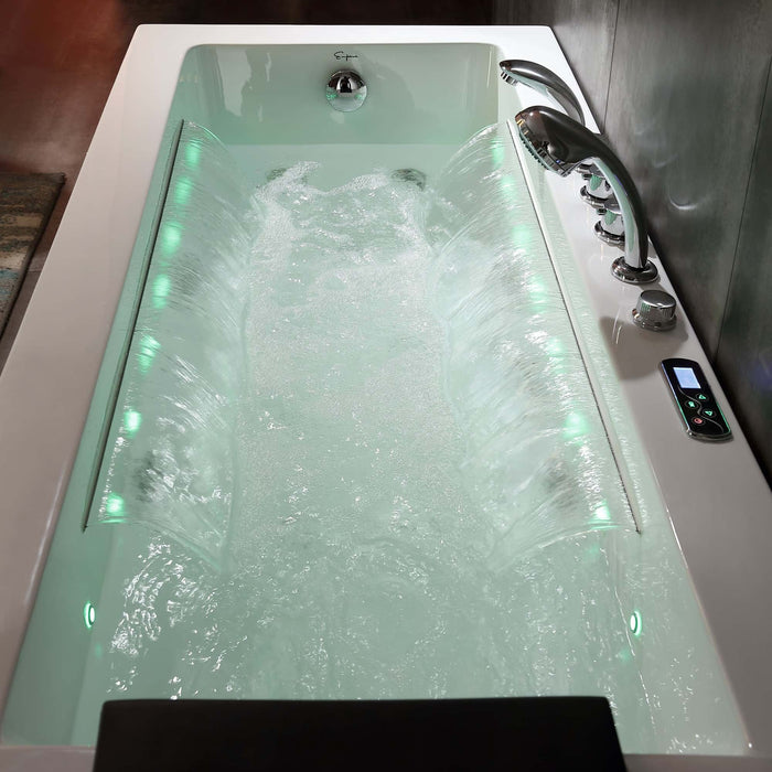 High-tech bathtub filled with turbulent water, illuminated with green lights and featuring multiple water jets and a digital control panel.