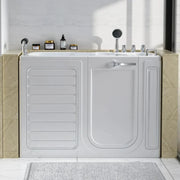 White walk-in bathtub with closed door, bathroom fixtures, and skincare products on marble shelf, set against light tile wall.