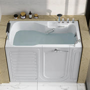 Walk-in bathtub filled with light blue water, with side door open and bath products on tiled shelf above.