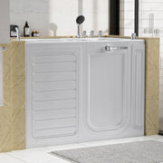 White walk-in bathtub with safety door, mounted between beige marble-style tiles, with showerhead and bathroom products nearby.