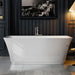 Modern white freestanding bathtub in elegant dark-paneled bathroom with black and white cityscape artwork and warm accent lighting.