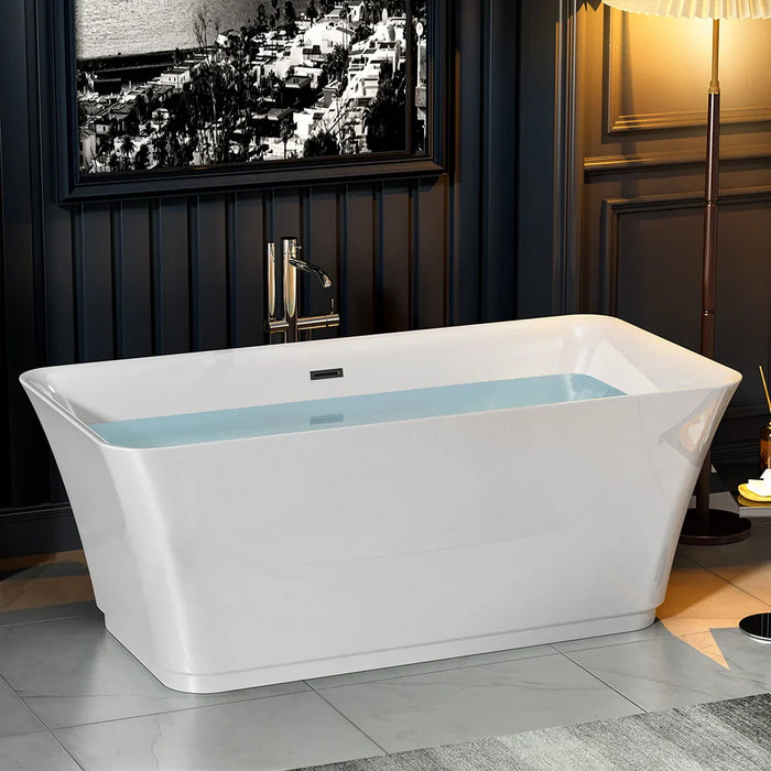 Modern white rectangular freestanding bathtub with water, placed on gray tile floor near dark paneled wall with black and white cityscape photo.