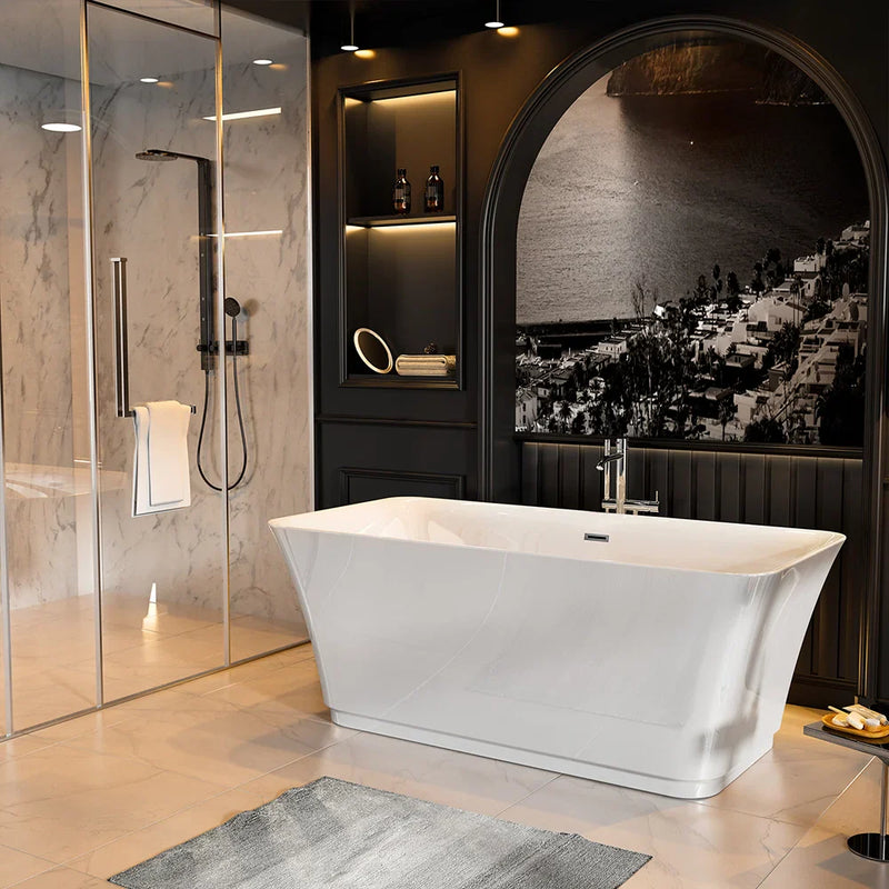 Modern bathroom with marble walls, white freestanding tub, glass shower, and arched mirror featuring a scenic black and white landscape.