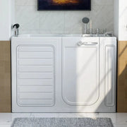 White walk-in bathtub with side door, mounted on beige and white tiled wall with shower fixtures above.