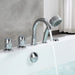 Chrome bathtub faucet with detachable shower head, running water, against a marble-like gray wall and white surface.
