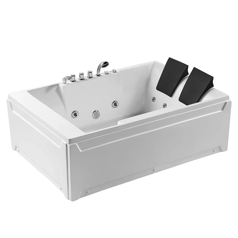 White rectangular two-person whirlpool bathtub with chrome faucet and jet fixtures, black headrest pillows on right side