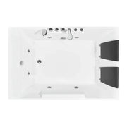 White rectangular bathtub with multiple water jets, faucet, and black side panels viewed from above.