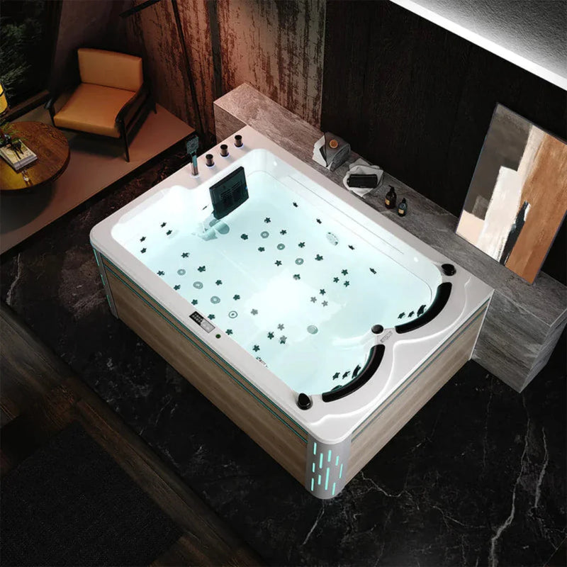 Modern hot tub with soft blue lighting, star and circle patterns, placed on dark marble floor near wooden wall and yellow chair
