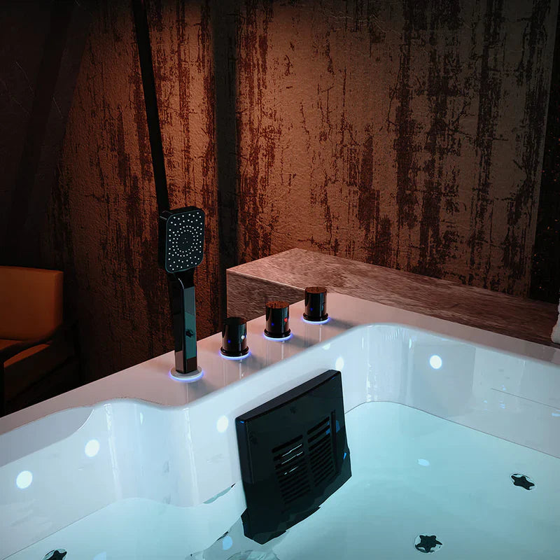 Modern bathtub with glowing blue-trimmed faucet controls and handheld showerhead, set against textured reddish-brown wall.
