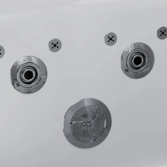 Metallic circular vents or speakers with intricate textured centers, arranged asymmetrically on a light gray background.