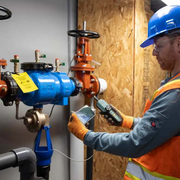 Extech Br450W A2 wireless borescope inspection worker using device with smartphone plumbing.