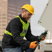 Extech Br450W A2 wireless borescope outdoor use worker holding device on rooftop.