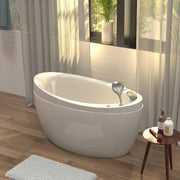Modern freestanding white bathtub with soft natural light filtering through sheer curtains, potted plant by window, bath products on side table.