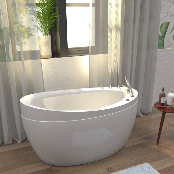 Modern white freestanding bathtub near window with soft curtains, potted plant, and wooden floor, creating a serene bathroom atmosphere.