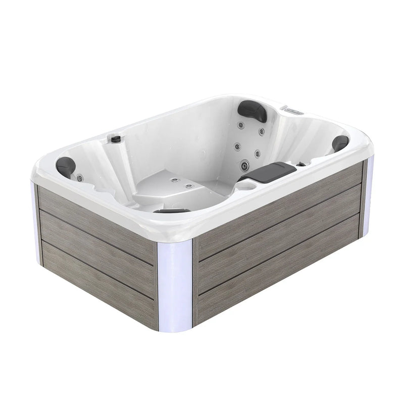 White hot tub with gray wooden panels, multiple jet nozzles, and black cushioned headrests, designed for outdoor relaxation.