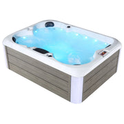 Blue and white hot tub with bubbling water, wooden panel exterior, multiple jets and LED lighting.