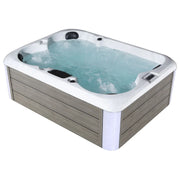 Bubbling hot tub with turquoise water, white interior, and gray wood-paneled exterior with multiple jets and control panel.
