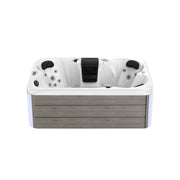 White hot tub with gray wooden exterior and multiple hydrotherapy jets, featuring black headrests and a central control panel.