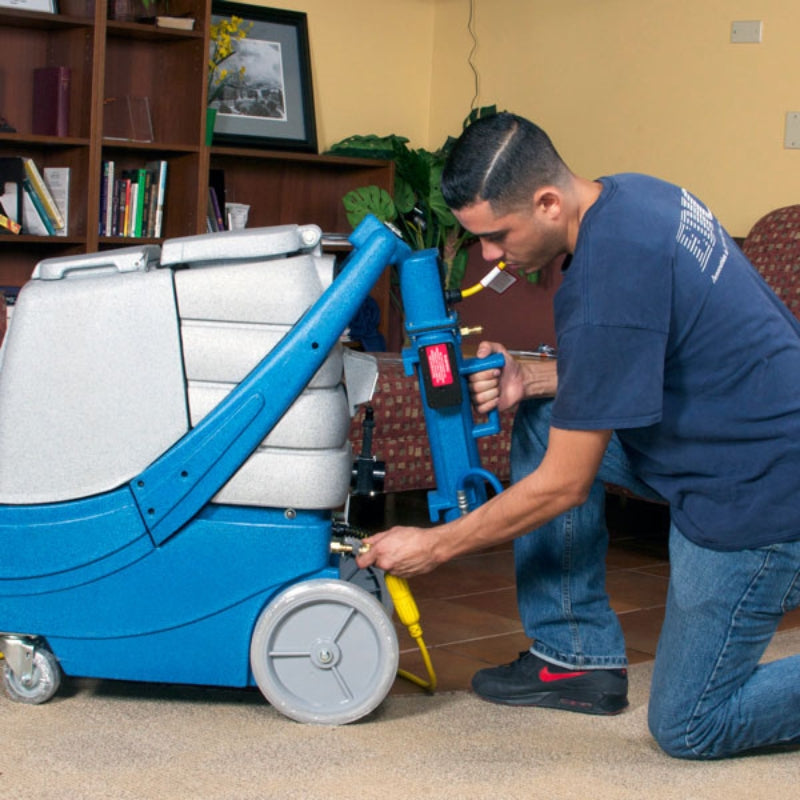 Man installing the Heat N Run external heater to an edic carpet extractor.