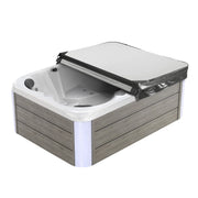 White and gray hot tub with black cover, featuring wood-textured side panels and multiple water jets.