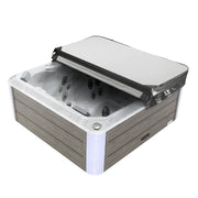 Hot tub with partial cover, wood-paneled exterior, multiple jets visible in white interior basin.