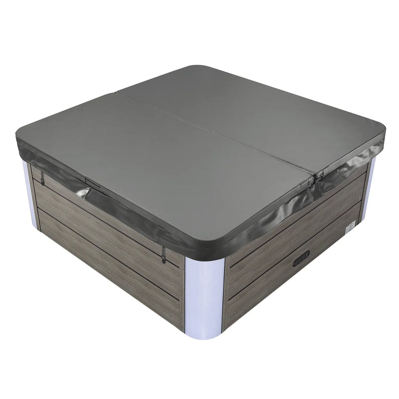 Hot tub with gray hard cover, wood-paneled exterior and white corner accents, closed and ready for use.