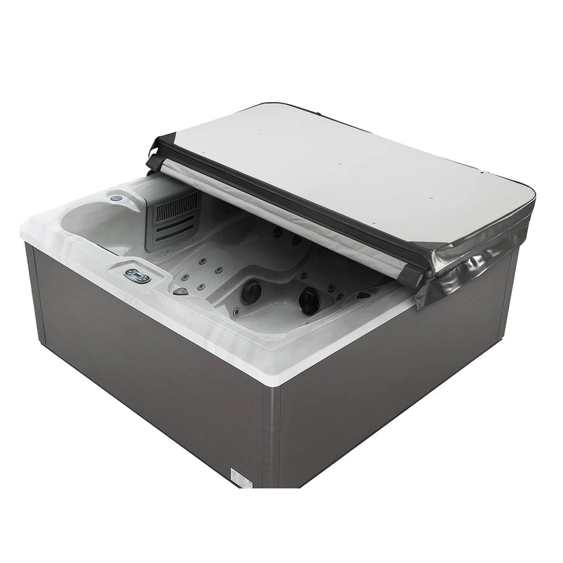 Gray and white hot tub with open cover, revealing interior jets and control panel