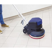 Powr-Flite Millennium Edition 20 Inch Floor Machine operator using machine on tile floor.