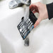 Prolux Comfort PLCOZ12K filter being rinsed under water.