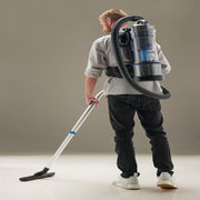 Prolux Lightweight 2.0 Bagless Upright Backpack Vacuum in use studio.