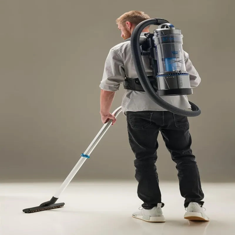 Prolux Lightweight 2.0 Bagless Upright Backpack Vacuum in use studio.