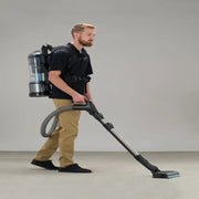Prolux Lightweight 2.0 person using vacuum.
