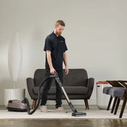 Prolux QX60 Pet Bagged Canister Vacuum in use living room.