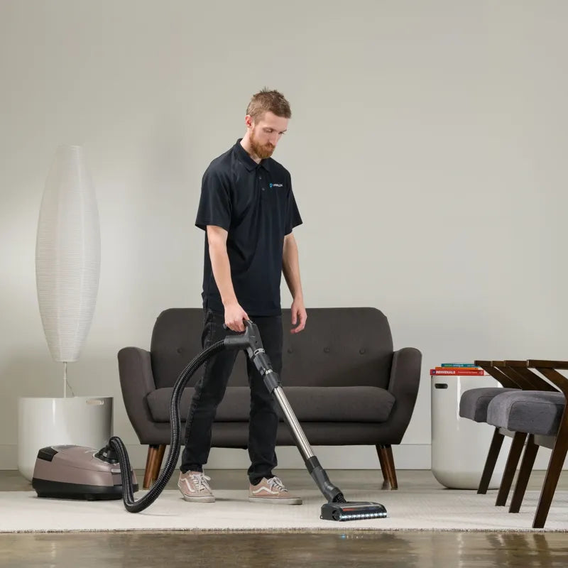 Prolux QX60 Pet Bagged Canister Vacuum in use living room.