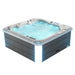 Aqua-colored hot tub with bubbling water and blue ambient lighting, featuring a gray wooden exterior and silver trim.