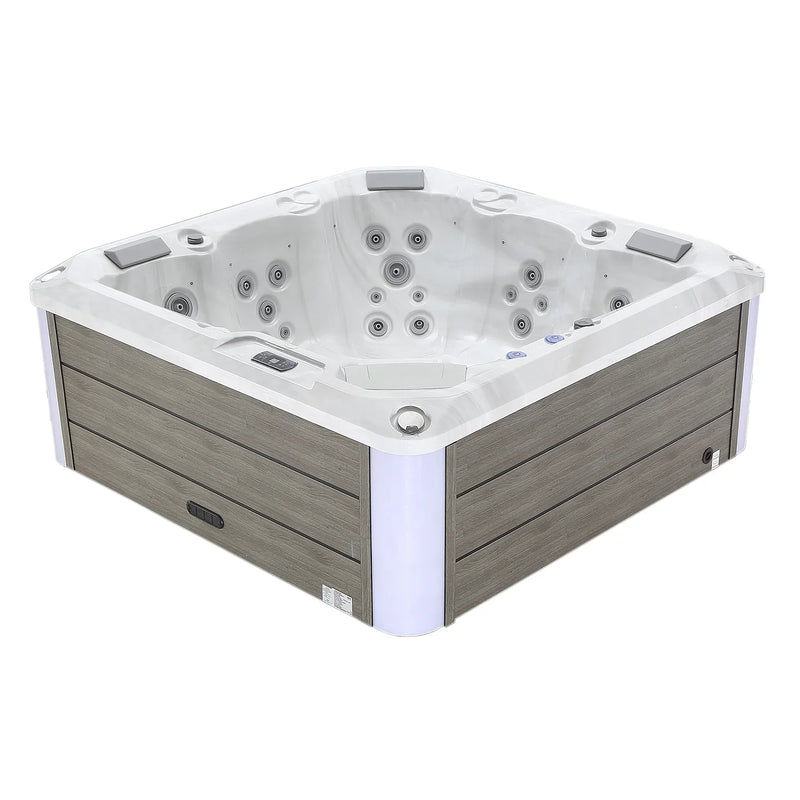 White and gray square hot tub with multiple water jets and wooden paneled exterior