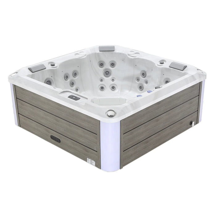 White and gray square hot tub with multiple water jets and wooden paneled exterior