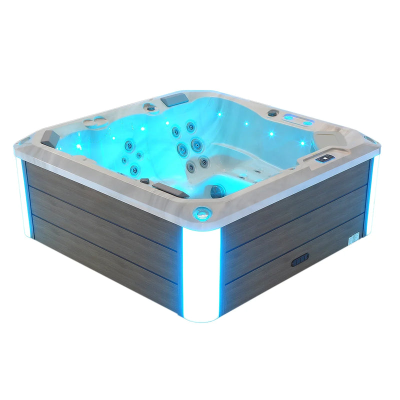 Modern hot tub with blue LED lighting and multiple hydrotherapy jets, featuring gray wood-like exterior panels.