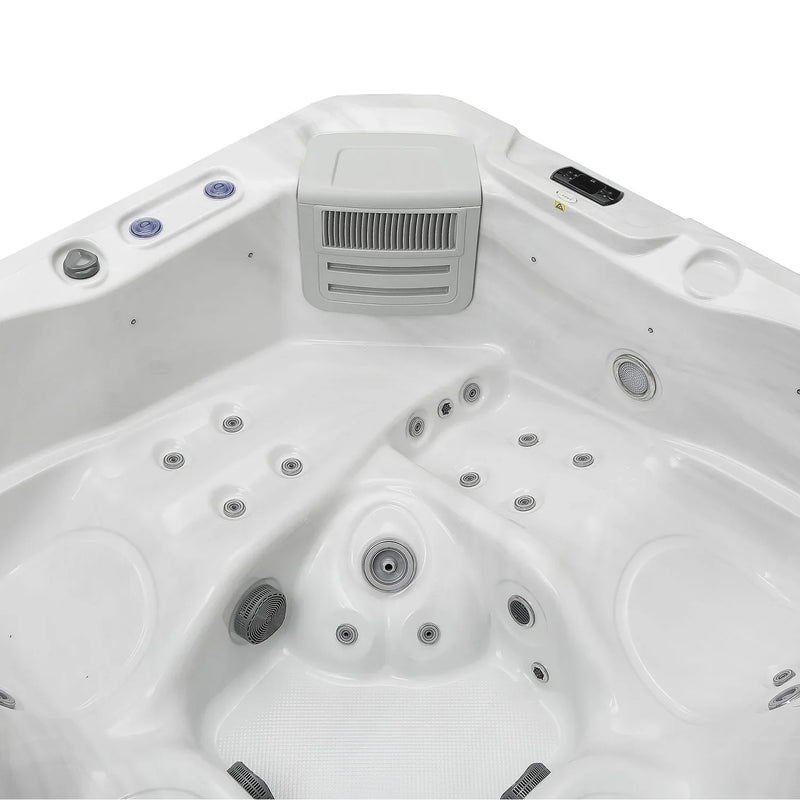 White hot tub with multiple circular jets and a gray ventilation unit in the center, viewed from above.
