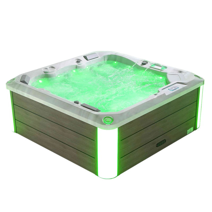 Hot tub with glowing green water and green accent lighting, filled with bubbling water and white and green exterior panels.