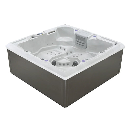 White and gray square hot tub with multiple jet nozzles, built-in seats, and a filtration unit, viewed from an angled perspective.
