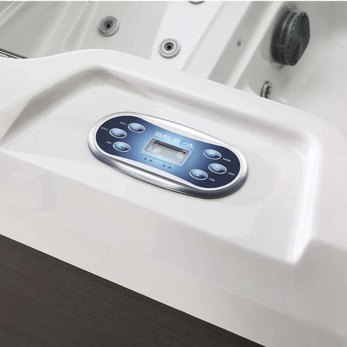 Balboa hot tub control panel with blue digital display and multiple buttons on white surface
