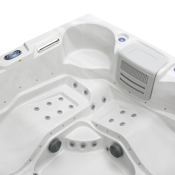 White hot tub with multiple jets, digital control panel, and curved seating design from overhead view.