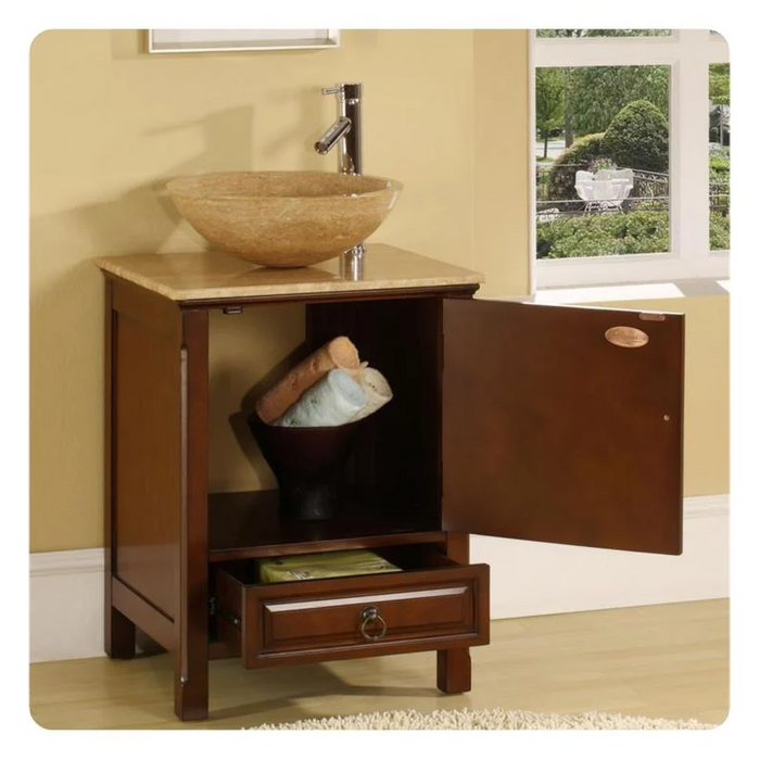 Wooden bathroom vanity with stone vessel sink, cabinet door open revealing towels, small drawer below, window in background