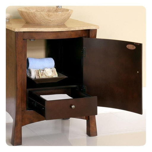 Dark wood bathroom vanity with stone vessel sink, open cabinet door revealing blue towel and drawer with storage shelf