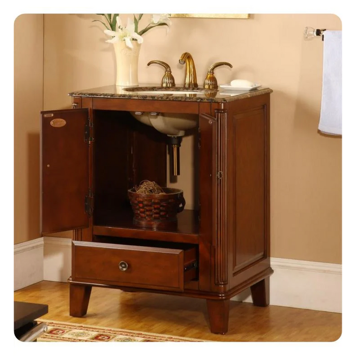Elegant wooden bathroom vanity with marble top, gold faucets, open cabinet, and woven basket on lower shelf.