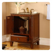 Elegant wooden bathroom vanity with marble top, gold faucets, open cabinet, and woven basket on lower shelf.